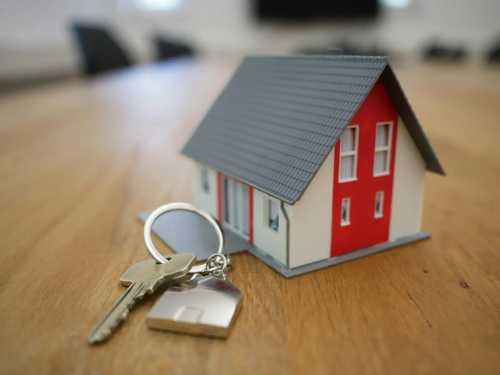 A model house beside a set of keys